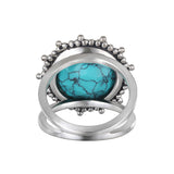 The back view of Nurture Your Voice Turquoise Silver Ring by Satya Jewelry, highlighting its unique design and craftsmanship, perfect for those who embrace the meaning and spirituality behind their jewelry choices for alignment with the sun and moon.