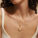 Intention of Harmony Necklace Set worn by a model, showcasing the gold sun and moon necklaces that embody spiritual energy for yoga and inner peace, enhancing meditation and protection.
