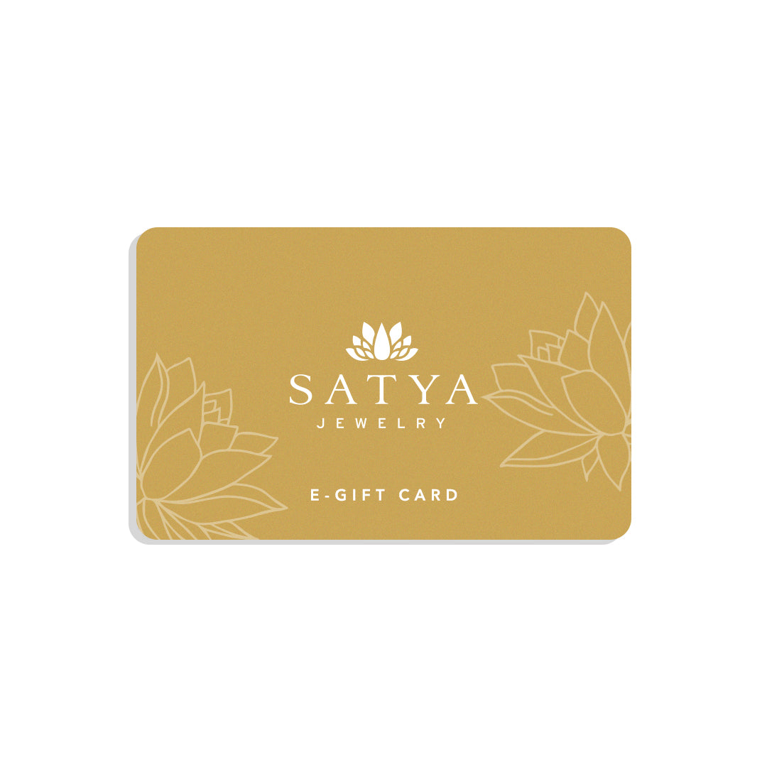 Elegant eGift Card design for SATYA Jewelry featuring a serene gold background with lotus patterns. Ideal for sharing meaningful gifts that embody spiritual jewelry values such as meditation, talisman energy, zodiac connections, and protection symbolism. Perfect for those seeking to manifest positivity and charm in their lives, aligning with yoga and spiritual practices.