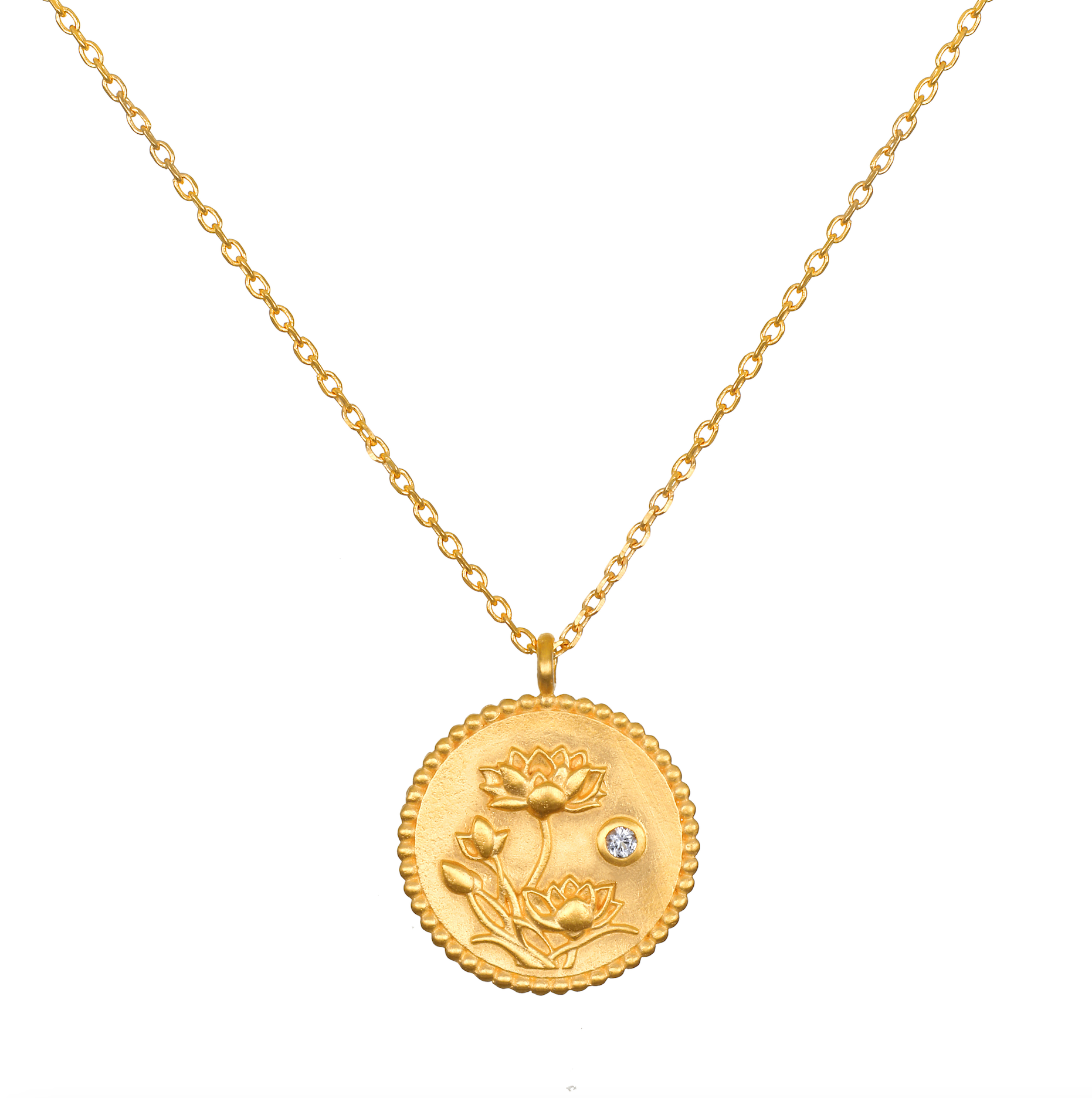 Joyful Beginnings Necklace features an intricate 18kt gold plated pendant adorned with lotus flowers and a white topaz stone, symbolizing new beginnings and individuality, perfect for spiritual jewelry, meditation, and meaningful charm.