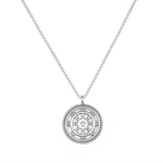 Pathway to Love Necklace in silver with a Tibetan Wheel of Life pendant. This meaningful spiritual jewelry serves as a talisman, ideal for meditation and yoga, embracing protection and a connection to zodiac energies and the essence of manifestation.