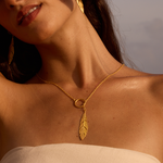 Close-up of a model wearing the Spiritual Messenger Feather Lariat Necklace, exuding elegance while highlighting its spiritual significance. This piece serves as a meaningful talisman and protection accessory, perfect for meditation and yoga enthusiasts.
