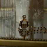 Taryn Truly Carry Peace Smoky Quartz Bottle Necklace