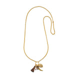 Gold chain necklace with small tassel, bead, and charm pendants hanging from clasp.