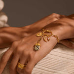 Close-up of the Charm Necklace Extender 1-1/2" adorned with charms reflecting spiritual themes, including a crescent moon and other symbols, perfect for those valuing yoga, spiritual growth, and meaningful connections.