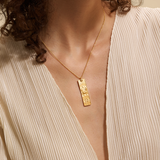 A model wearing the Story of Cancer Zodiac Necklace, highlighting its elegant design. This spiritual jewelry resonates with the energies of zodiac signs, promoting meditation and offering a meaningful symbol of protection, sun, moon, and spirituality.