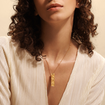 Model wearing the Story of Gemini Zodiac Necklace, showcasing this spiritual jewelry that embodies the essence of the zodiac, perfect for yoga and meaningful self-exploration.