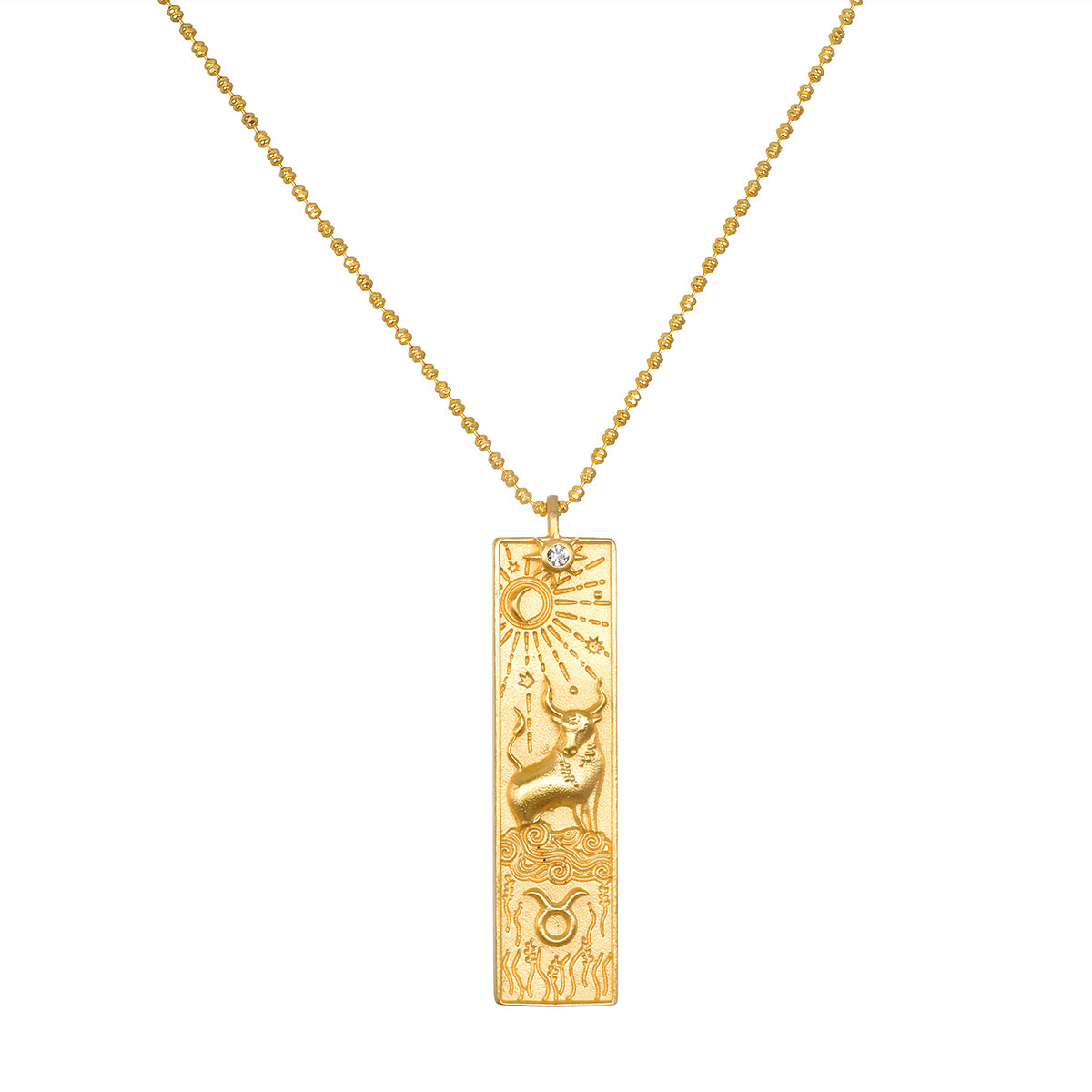 Story of Taurus Zodiac Necklace featuring an intricate gold pendant depicting the Taurus symbol along with celestial elements. This spiritual jewelry piece is perfect for meditation and serves as a talisman, connecting you with your zodiac sign. It embodies meaningful protection and manifestation energy, ideal for yoga practice.