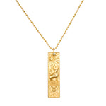 Story of Taurus Zodiac Necklace featuring an intricate gold pendant depicting the Taurus symbol along with celestial elements. This spiritual jewelry piece is perfect for meditation and serves as a talisman, connecting you with your zodiac sign. It embodies meaningful protection and manifestation energy, ideal for yoga practice.
