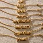 A collection of zodiac script necklaces including the Pisces Intuition Zodiac Script Necklace, representing various signs. Each piece, featuring golden designs, embodies spiritual protection and is perfect for meditation and manifestation.