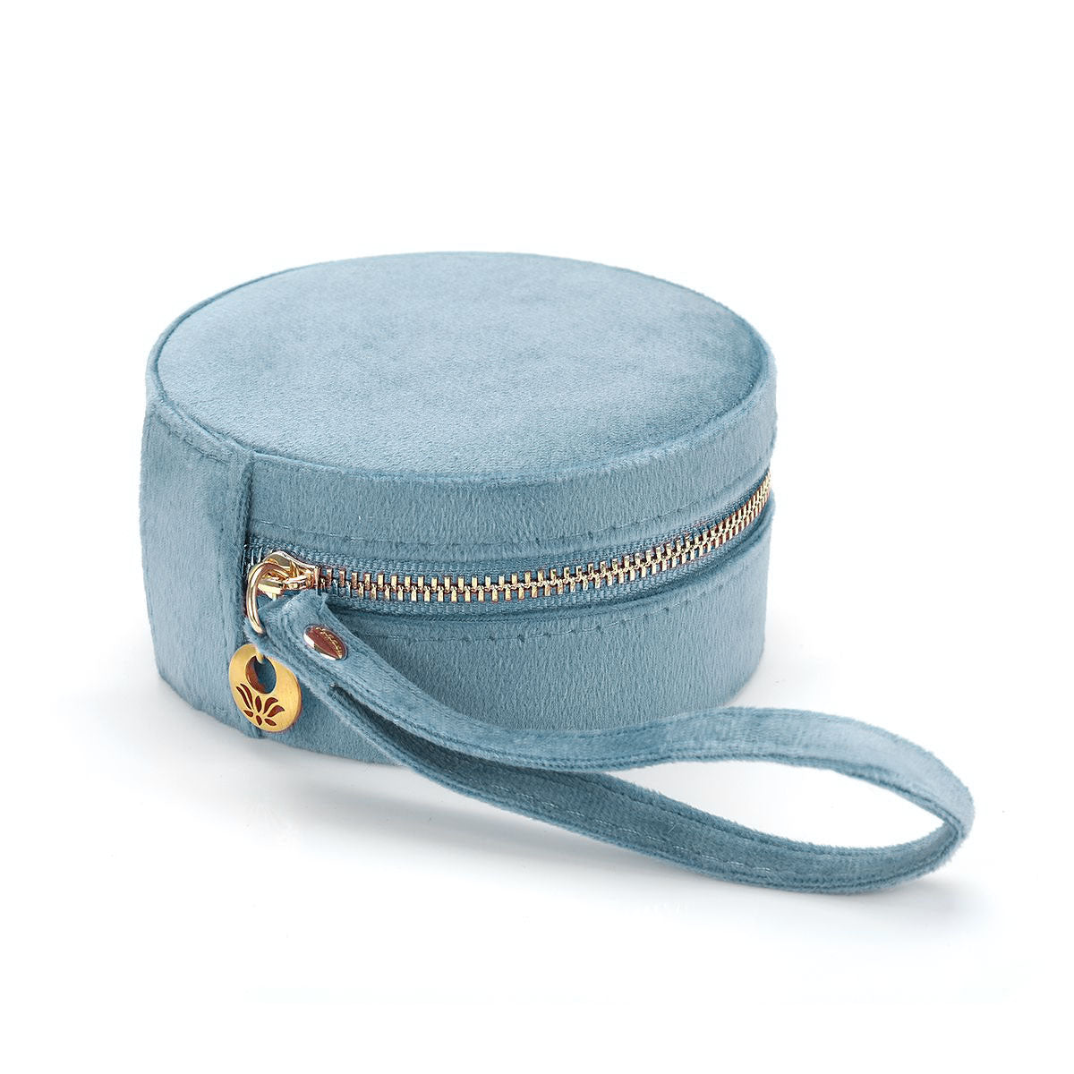 Exterior view of the For the Journey Travel Jewelry Case in soft blue velvet with a golden zipper and wrist loop. A stylish accessory for anyone who cherishes their spiritual jewelry and seeks to carry their meaningful pieces, such as zodiac symbols and malas, on their journey.