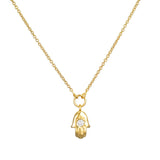 Mini Hamsa Diamond 14kt Gold Pendant Necklace displayed on a delicate chain, symbolizing protection and blessings. This spiritual jewelry piece represents meditation and is a meaningful talisman for manifestation, making it perfect for yoga enthusiasts. The diamond accent adds charm and clarity to this elegant necklace.