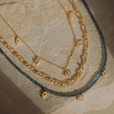 Find Your Center Blue Topaz Charm Necklace