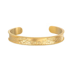 Breaking Dawn Sunrise Cuff bracelet showcasing an elegant etched sunrise design, perfect for spiritual jewelry and meditation. This 18kt gold plated cuff embodies the sun's energy, making it a meaningful talisman for yoga and manifestation.