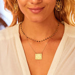 The Sacred Commencement Lotus Necklace styled with matching earrings, exuding elegance and spirituality, ideal for yoga and meditation, representing the essence of new beginnings and the cycle of life.