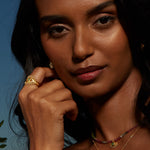 Portrait of a woman wearing the Shed a Light Evil Eye Ring Set, highlighting the elegant design that embodies spiritual jewelry, protection, and enlightenment, perfect for those seeking a charm for meditation and manifestation.