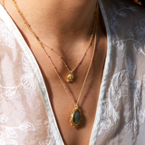 Close-up of the Pursue Your Truth Labradorite Necklace, featuring a stunning labradorite pendant set in 18k gold plate sun rays, perfect as spiritual jewelry and a meaningful meditation gift. Ideal for those seeking inspiration and symbolic protection in their yoga practice.
