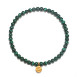 Personal Evolution Lotus Malachite Gemstone Bracelet featuring smooth round malachite beads and a delicate golden lotus charm, embodying spiritual jewelry for meditation and meaningful manifestation.