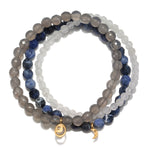 Peace & Protection Moon Gemstone Bracelet Set showcasing a trio of white jade, grey agate, and sodalite beads. This spiritual jewelry promotes inner peace, creativity, and joy, making it a perfect gift for meditation and yoga practices. Each bead symbolizes protection and meaningful connections, ideal for those seeking manifestations and amulets to enhance their sacred journey.
