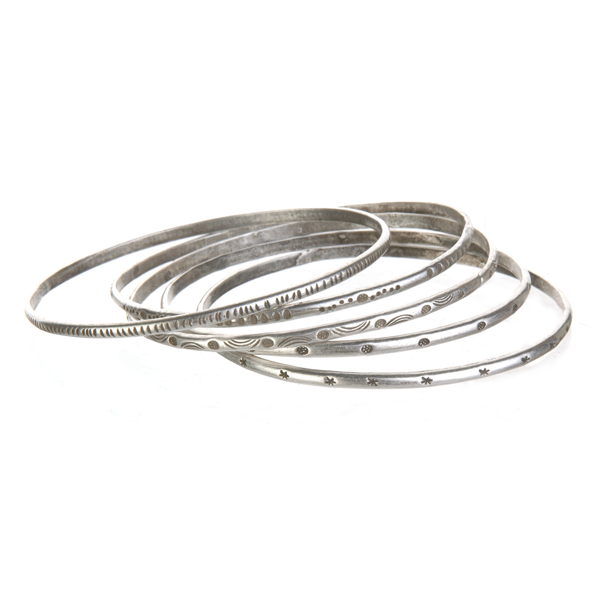 A collection of Silver Etched Bracelets Bangles titled Melody, showcasing various hand-stamped designs, perfect for spiritual jewelry and meditation gifts, embodying symbolic meaning and manifestation energy for yoga enthusiasts.