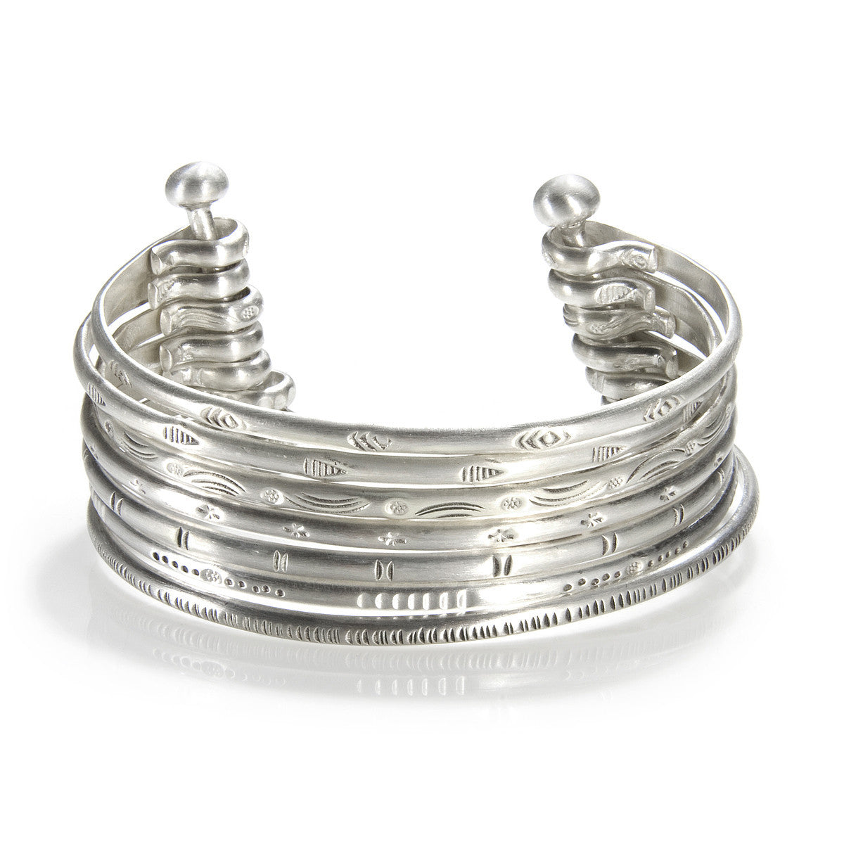 Small Silver Multi Bangle Cuff showcasing a stylish design, symbolizing spiritual jewelry and meaningful adornment, perfect as a meditation gift or for yoga practices. This cuff, with its protective and sacred elements, embodies the essence of manifestation and hamsa symbolism.