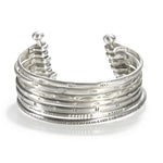 Small Silver Multi Bangle Cuff showcasing a stylish design, symbolizing spiritual jewelry and meaningful adornment, perfect as a meditation gift or for yoga practices. This cuff, with its protective and sacred elements, embodies the essence of manifestation and hamsa symbolism.