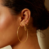 Close-up of the Stand By Your Side Ear Cuff worn with various gold earrings, reflecting a beautifully layered look in spiritual jewelry. This piece captures the essence of protection and meaning for yoga and meditation.