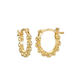 Tiny Joys 14kt Gold Dot Huggie Mini Hoops, featuring delicate gold hoop earrings adorned with dots, perfect for everyday wear. This spiritual jewelry piece embodies joy and is a meaningful talisman for those on a journey of manifestation. Ideal for yoga enthusiasts, these hoops reflect the essence of zodiac and protection, symbolizing the sun and moon.