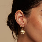 Model wearing Sacred Shelter Earrings, showcasing their elegance and symbolic design, perfect for yoga and mantra practice, serving as a sacred amulet for spiritual enhancement.