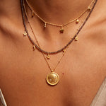 A detailed view of layered necklaces including the Sacred Sisterhood Constellation Necklace, featuring gold chains and star charms, reflecting spiritual jewelry that connects to the meaning of beauty and harmony, ideal for manifestation, yoga practice, and sacred rituals.
