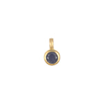 Close-up of the Sapphire Bezel Charm featuring a deep blue sapphire set in 18kt gold plate, representing trust, protection, and love. A beautiful piece of spiritual jewelry for those who seek meaning and manifestation in life, ideal for adding to charm necklaces. Perfect for yoga practitioners and meditation enthusiasts.