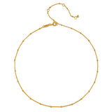 Image of Subtle Beauty Dot Chain Choker showcasing an elegant 18kt gold plated chain adorned with delicate golden dots, perfect for layering. This spiritual jewelry piece resonates with themes of meditation, talisman, and protection, symbolizing the sun and moon, ideal for yoga enthusiasts seeking meaningful manifestations.
