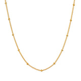 Subtle Beauty Dot Chain Choker displayed on a white background, showcasing its elegant design featuring golden dots. This spiritual jewelry piece is perfect for meditation and reflects a meaningful connection to the sun and moon.