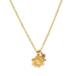 Bloom in Peace Lotus & Tourmaline Necklace featuring a delicate lotus flower pendant and pink tourmaline. This piece embodies spiritual jewelry for meditation, serving as a talisman for zodiac energy and meaningful manifestations in yoga practice.
