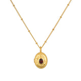 Lotus Garnet Birthstone Locket Necklace - January, featuring a sparkling red garnet set in an 18kt gold plated locket, symbolizing new beginnings and protection, perfect for meditation and manifestation as spiritual jewelry.