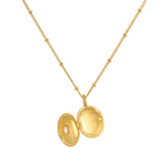Open view of the Lotus Pearl Birthstone Locket Necklace - June, highlighting its ability to serve as a talisman and a source of spiritual meaning within meditation and protection rituals.