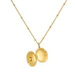 Lotus Peridot Birthstone Locket Necklace - August open to show interior, inviting you to personalize this spiritual jewelry, which symbolizes new beginnings and the essence of manifestation.