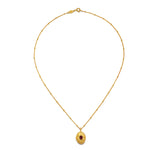 The Lotus Pink Tourmaline Birthstone Locket Necklace - October laid flat against a white surface, showcasing the gold plating, design, and its significance as a talisman for protection and introspection.