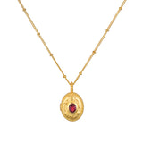 Lotus Pink Tourmaline Birthstone Locket Necklace - October displayed on a neutral background, showcasing the intricate design and faceted pink tourmaline gemstone, embodying spiritual jewelry, protection, and meaningful charm for meditation and self-discovery.