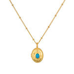 Lotus Turquoise Birthstone Locket Necklace - December showcased prominently, featuring 18kt gold plating and a striking turquoise stone. This spiritual jewelry serves as a meaningful talisman, perfect for meditation and manifestation, embodying charm and protection.