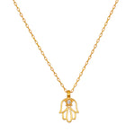 Gold-tone hamsa hand pendant with crystal accent on delicate chain necklace.