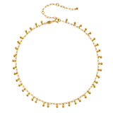 Joyful Choker Necklace displayed against a white background, highlighting its delicate gold design with round balls. This versatile necklace is perfect for anyone seeking meaningful spiritual jewelry that aligns with their yoga and meditation practices.