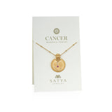 Mandala Zodiac Cancer Ruby Necklace displayed on elegant packaging, showcasing this unique spiritual jewelry piece. With its rich symbolism of the Cancer zodiac, this talisman promotes a deeper connection during meditation and serves as a protective charm. This necklace embodies a meaningful expression for yoga enthusiasts, representing the power of manifestation and spiritual growth.