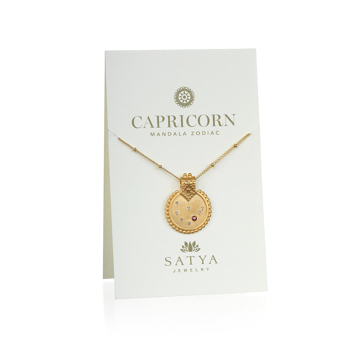 Mandala Zodiac Capricorn Red Garnet Necklace displayed on a beautiful presentation card by Satya Jewelry. This sacred amulet combines the essence of Capricorn with a touch of hamsa symbolism, ideal for spiritual jewelry and meditation gifts.