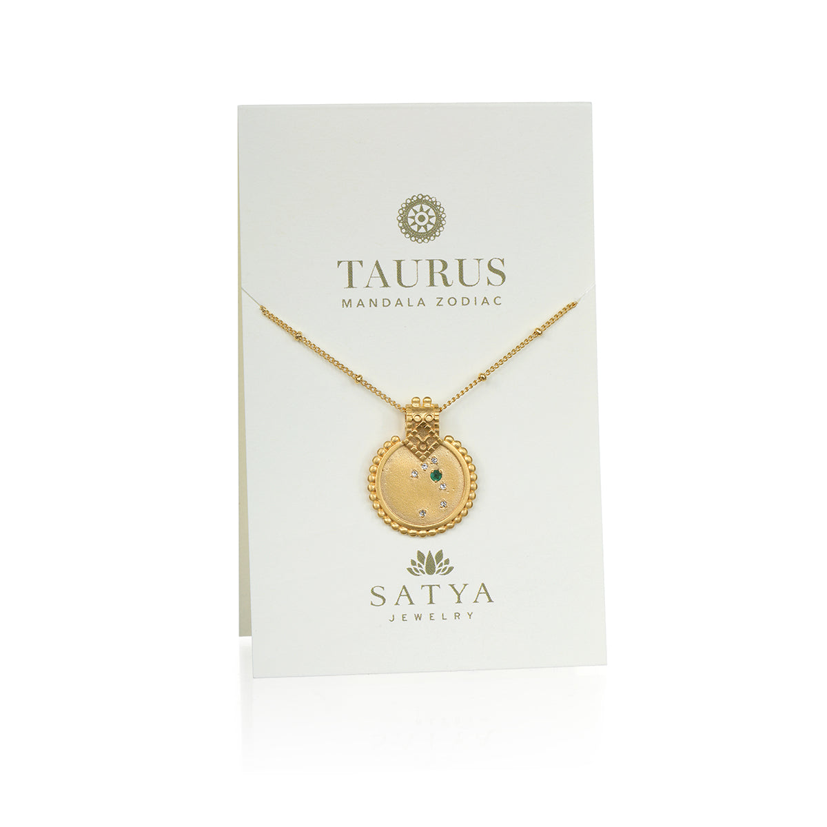 The Mandala Zodiac Taurus Emerald Necklace presented on a stylish card by Satya Jewelry, emphasizing its zodiac significance. This piece serves as a sacred talisman for Taurus, making it a perfect thoughtful gift for those seeking spiritual jewelry rich in meaning and protection.