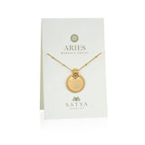 The Mandala Zodiac Aries White Topaz Necklace elegantly displayed on a branded card, emphasizing its role as a symbolic piece of jewelry. This beautiful amulet connects with the energy of the Aries zodiac, making it an ideal manifestation tool for those seeking inspiration in their spiritual practices.