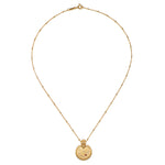 Mandala Zodiac Capricorn Red Garnet Necklace displayed elegantly, crafted with 18kt gold plating, embodying spiritual jewelry and a meaningful amulet for meditation, manifestation, and yoga enthusiasts.