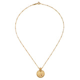 Mandala Zodiac Capricorn Red Garnet Necklace displayed elegantly, crafted with 18kt gold plating, embodying spiritual jewelry and a meaningful amulet for meditation, manifestation, and yoga enthusiasts.