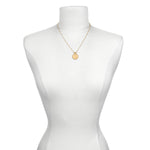 Mandala Zodiac Capricorn Red Garnet Necklace showcased on a minimalist dress form, symbolizing protection and spiritual significance, perfect as a meditation gift or sacred accessory for zodiac lovers.