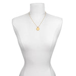 The Mandala Zodiac Virgo Sapphire Necklace on a mannequin, emphasizing its beauty and style. An ideal talisman for those seeking spiritual growth, this necklace embodies the qualities of the Virgo zodiac, sun, moon, and the power of manifestation.